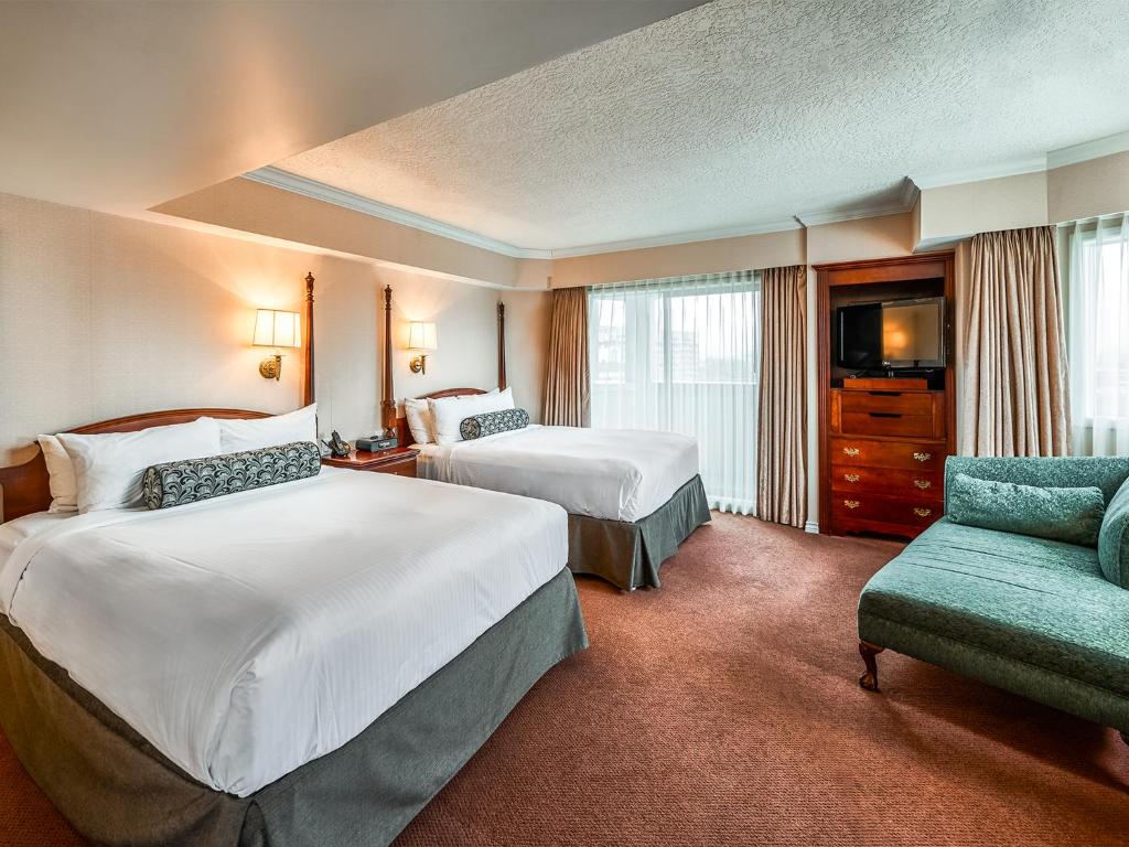 Postel nebo postele na pokoji v ubytování Hotel Grand Pacific