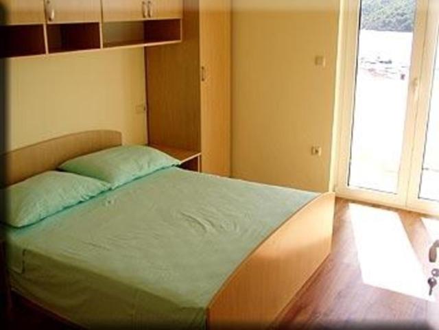 Posteľ alebo postele v izbe v ubytovaní Apartment in Kampor with sea view, terrace, air conditioning, Wi-Fi (4610-5)