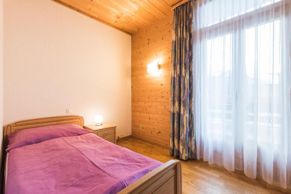 Postel nebo postele na pokoji v ubytování Hotel Alpenrose beim Ballenberg