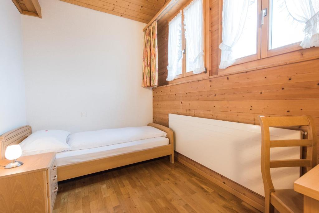 Postel nebo postele na pokoji v ubytování Hotel Alpenrose beim Ballenberg