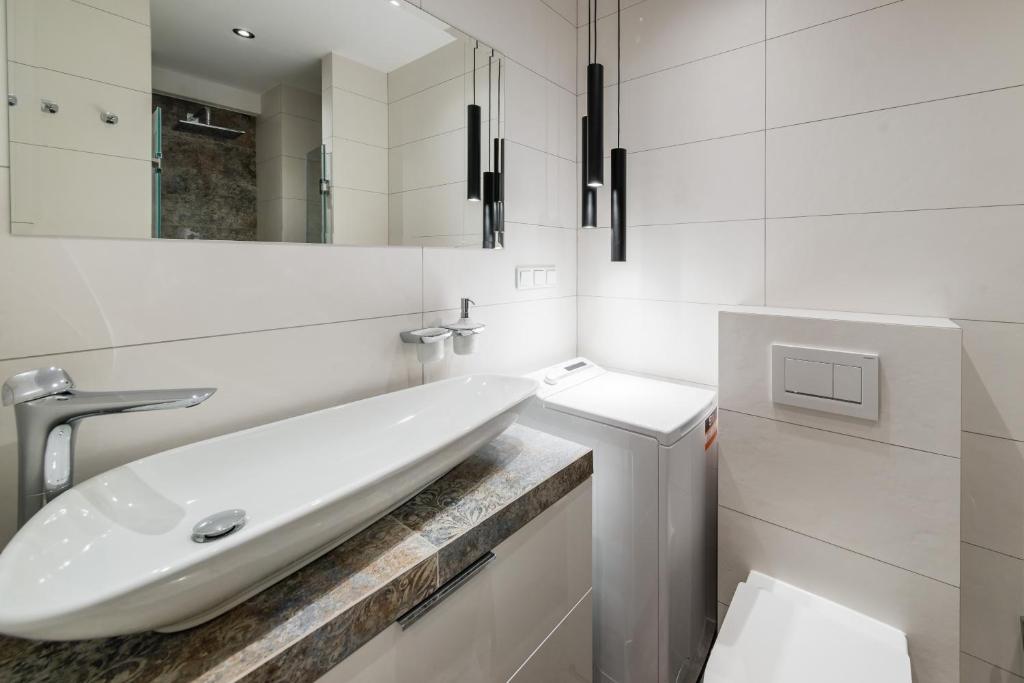 Kúpeľňa v ubytovaní Deluxe Apartment Rakowicka 15 WAWELOFTS