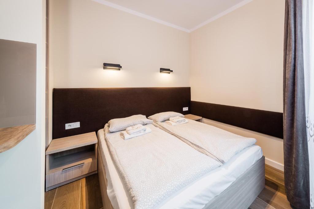 Posteľ alebo postele v izbe v ubytovaní Deluxe Apartment Rakowicka 15 WAWELOFTS