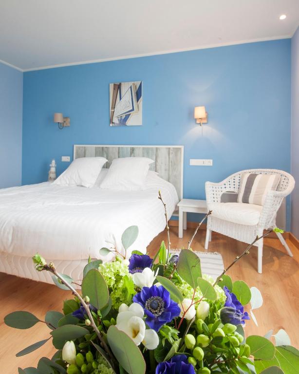 Postel nebo postele na pokoji v ubytování Hôtel Des Argousiers
