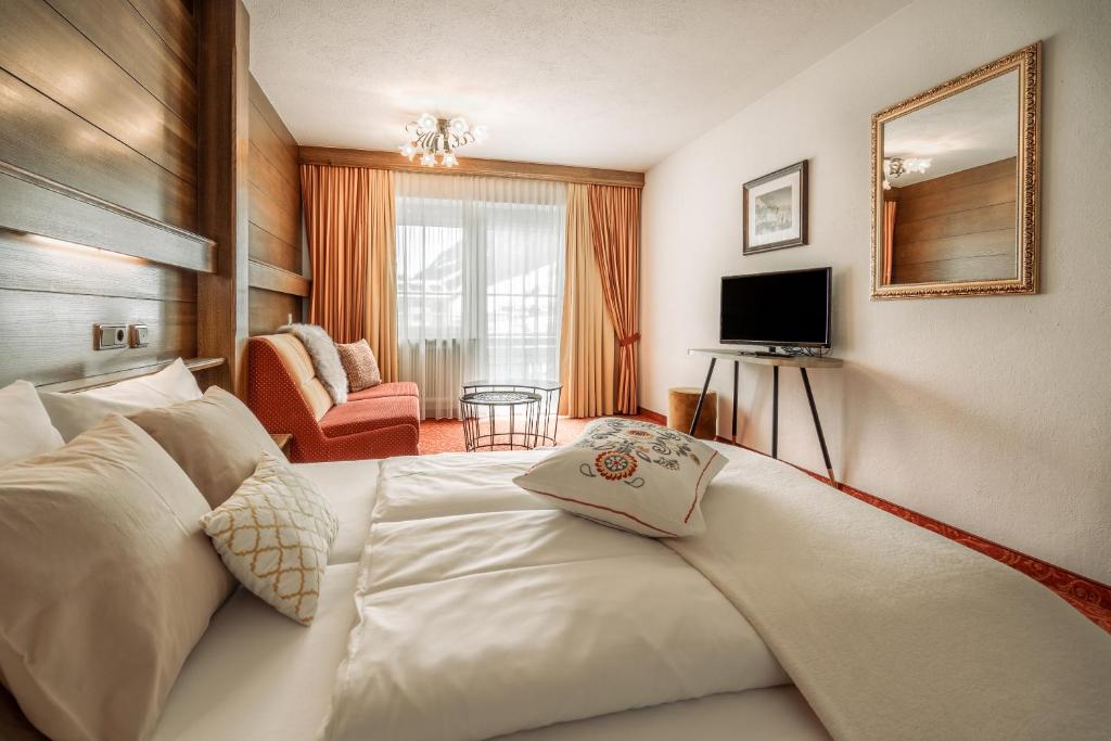TV a/nebo společenská místnost v ubytování Fortuna Apart Hotel B&B