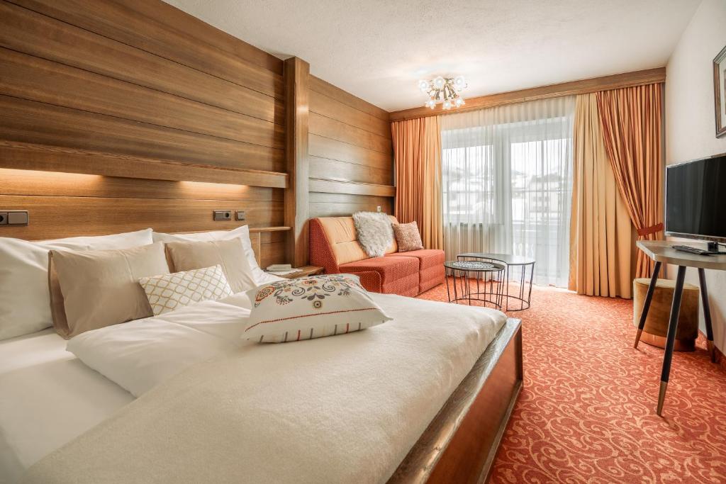 TV a/nebo společenská místnost v ubytování Fortuna Apart Hotel B&B