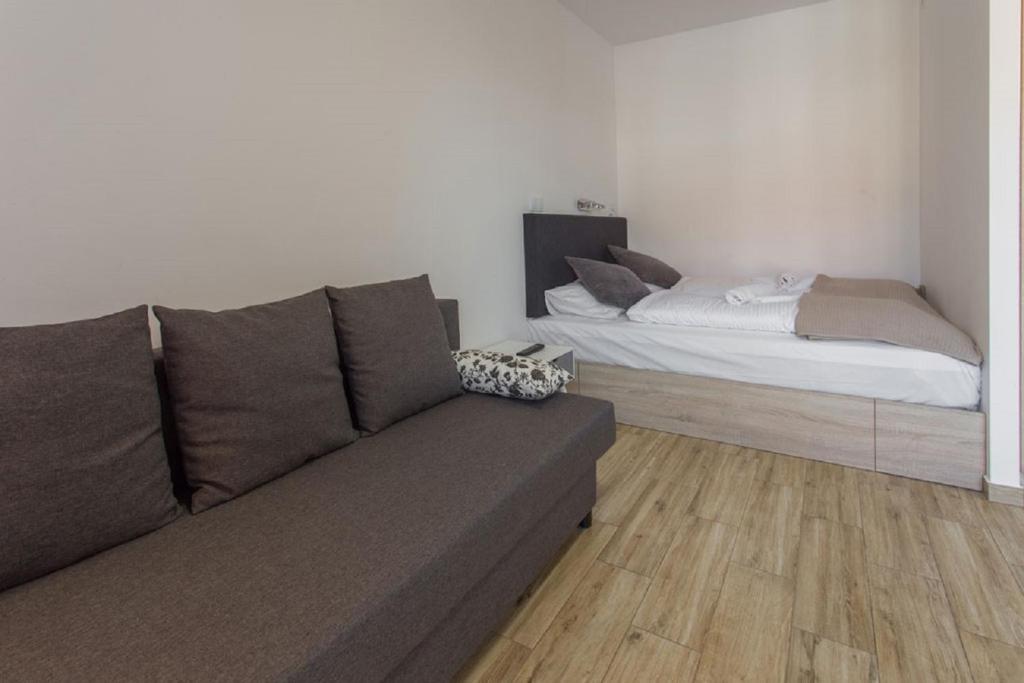 Posteľ alebo postele v izbe v ubytovaní K2 Apartamenty