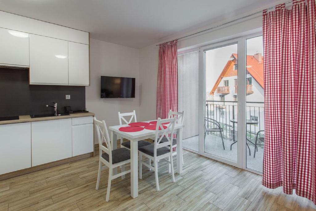 Kuchyňa alebo kuchynka v ubytovaní K2 Apartamenty