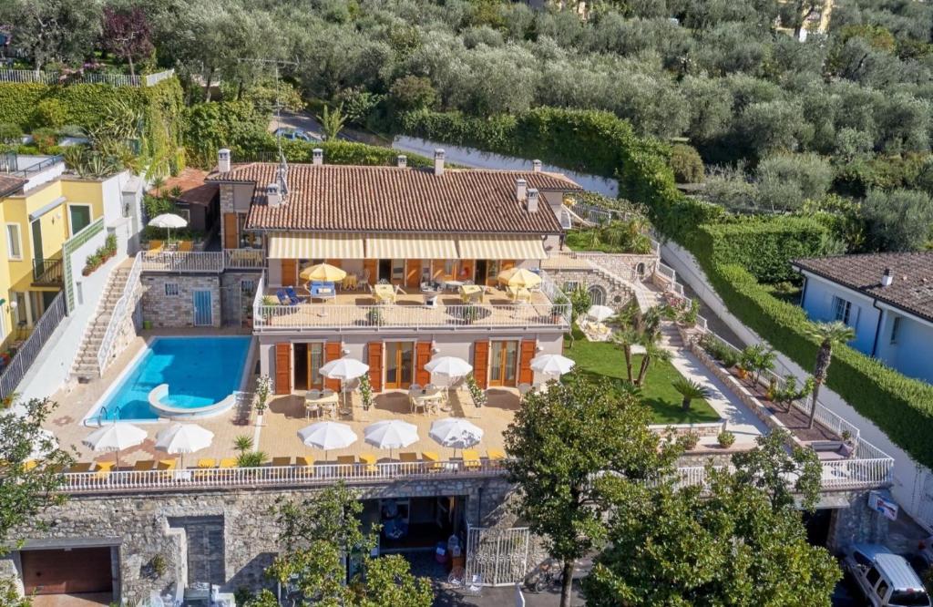 an aerial view of a house with a swimming pool at Residence La Cioca in Malcesine