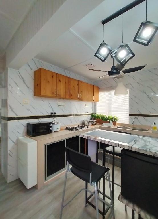 Kuchyň nebo kuchyňský kout v ubytování Maya Homestay Putrajaya @ Twelve