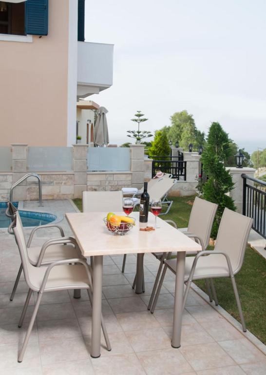A balcony or terrace at Peonia and Ortansia Villas - Few Steps from the beach