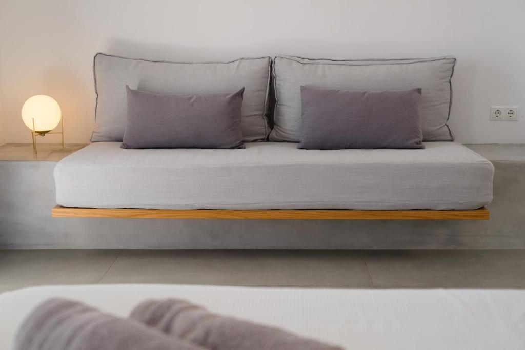 Postel nebo postele na pokoji v ubytování Ihthioessa Boutique Hotel