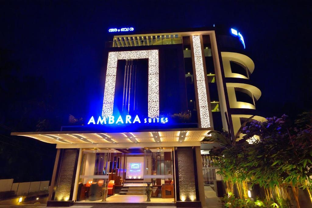 a building with a sign that reads amazonarma hits at Ambara Suites in Trivandrum