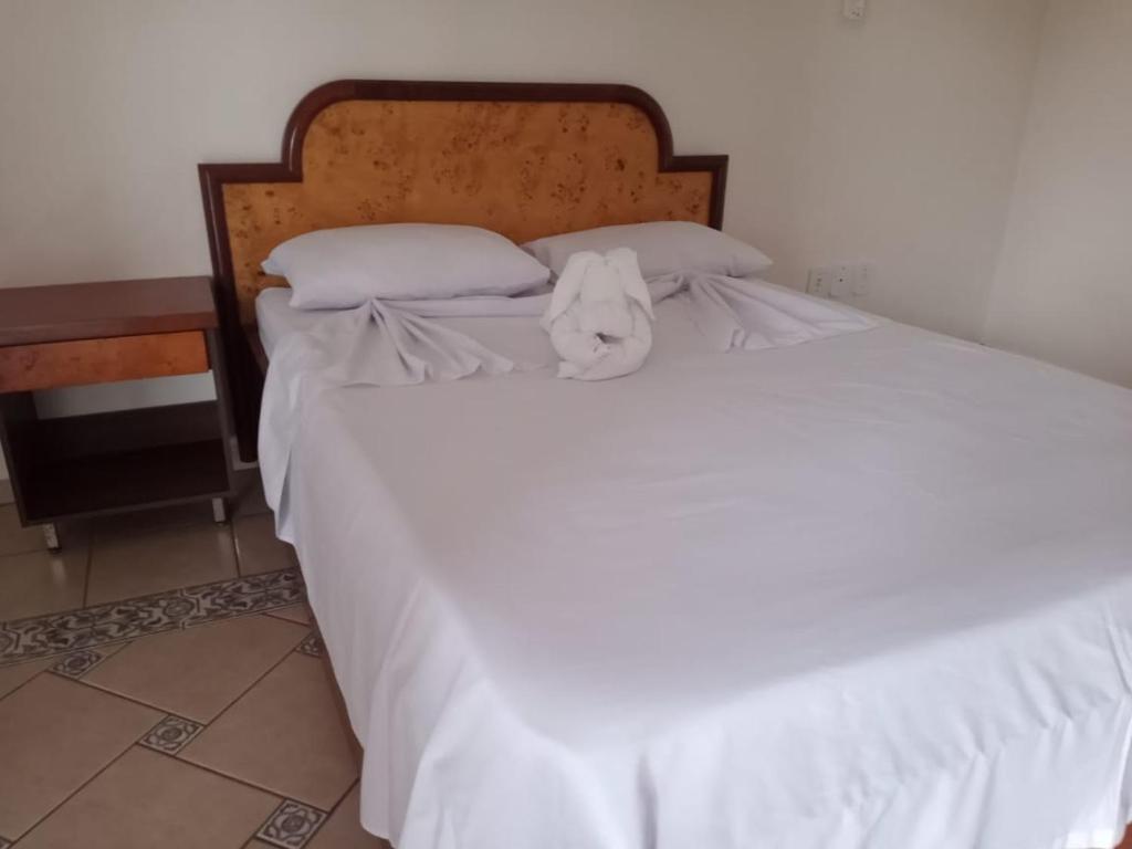 Łóżko lub łóżka w pokoju w obiekcie Pousada 4 Estações