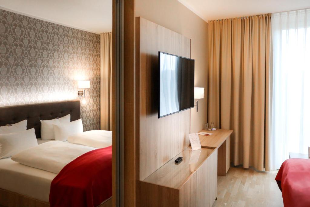 Postel nebo postele na pokoji v ubytování Schloss Breitenfeld Hotel & Tagung