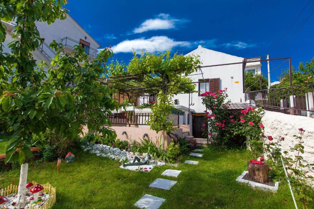a garden in front of a house at BORNA in Crikvenica