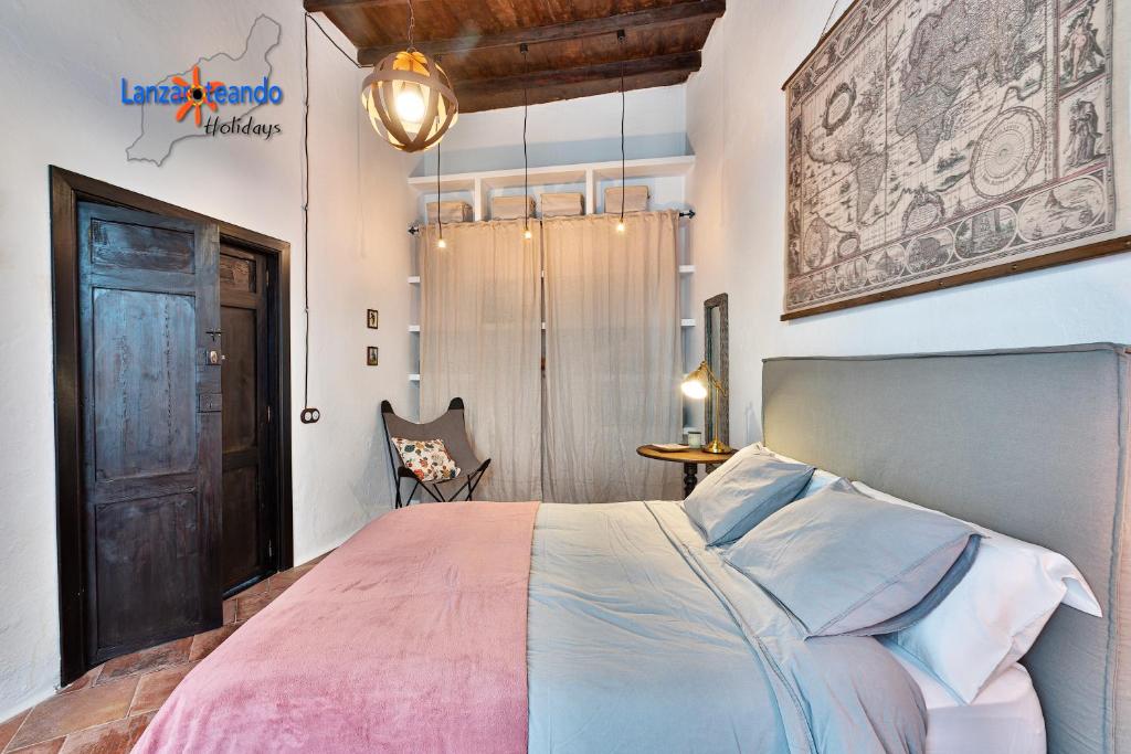 Postel nebo postele na pokoji v ubytování Vivienda Vacacional El Patio de Franky