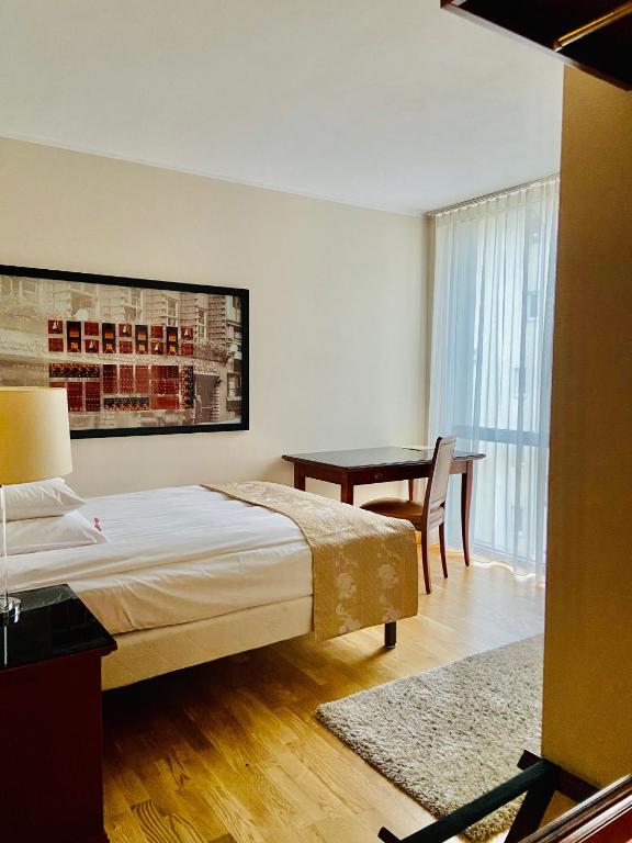 Postel nebo postele na pokoji v ubytování Hotel Paradis