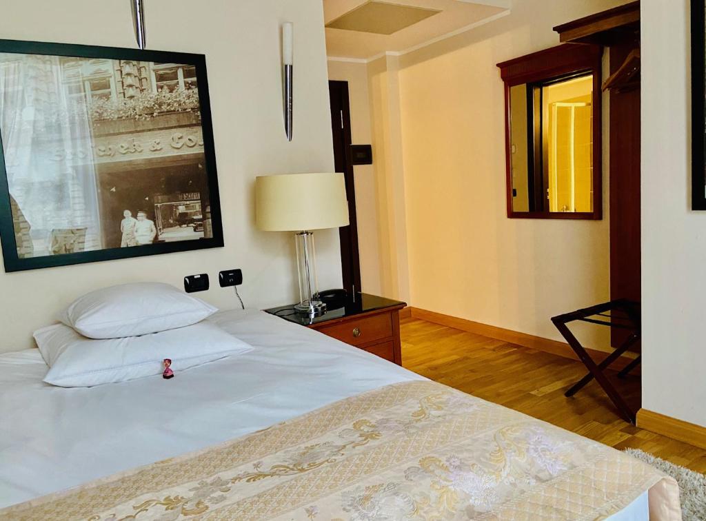 Postel nebo postele na pokoji v ubytování Hotel Paradis