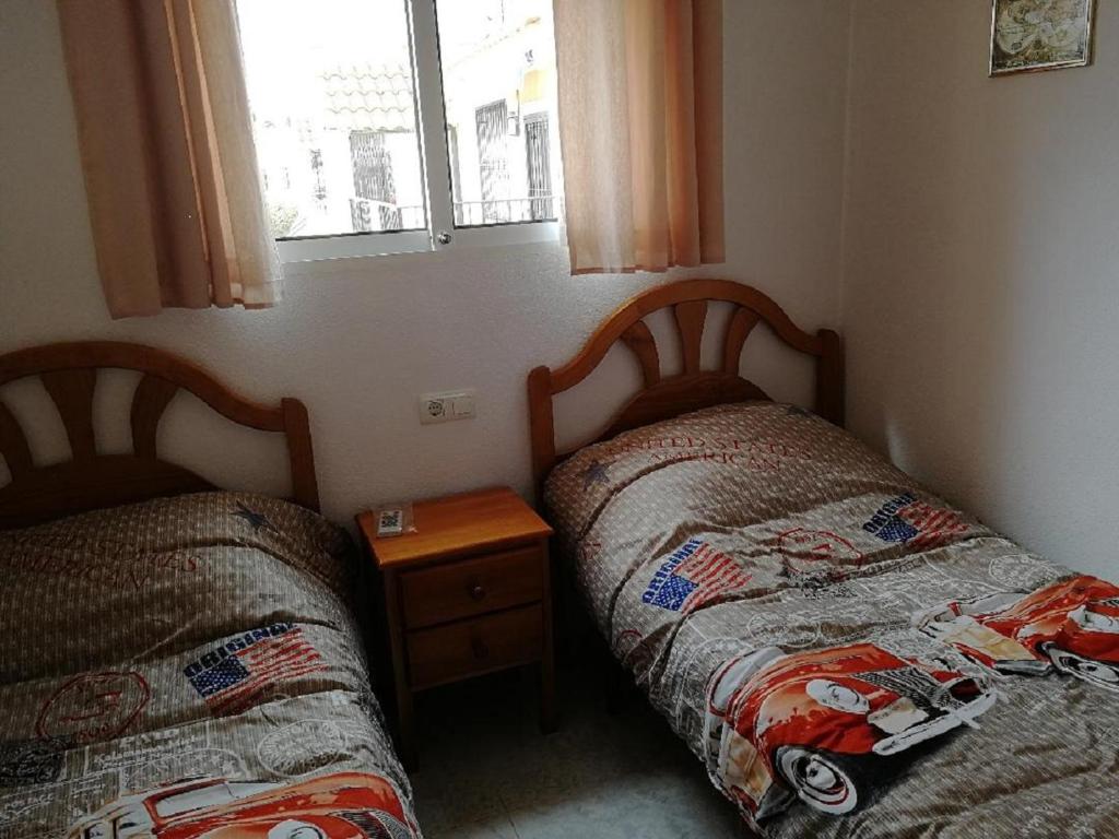 A bed or beds in a room at Casa Joleen 1