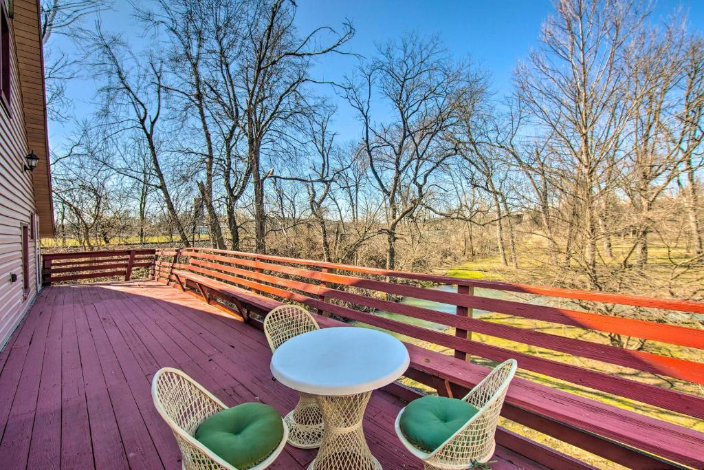 a table and chairs sitting on a wooden deck at Runningwater Apartment in Lancaster with Deck in Lancaster