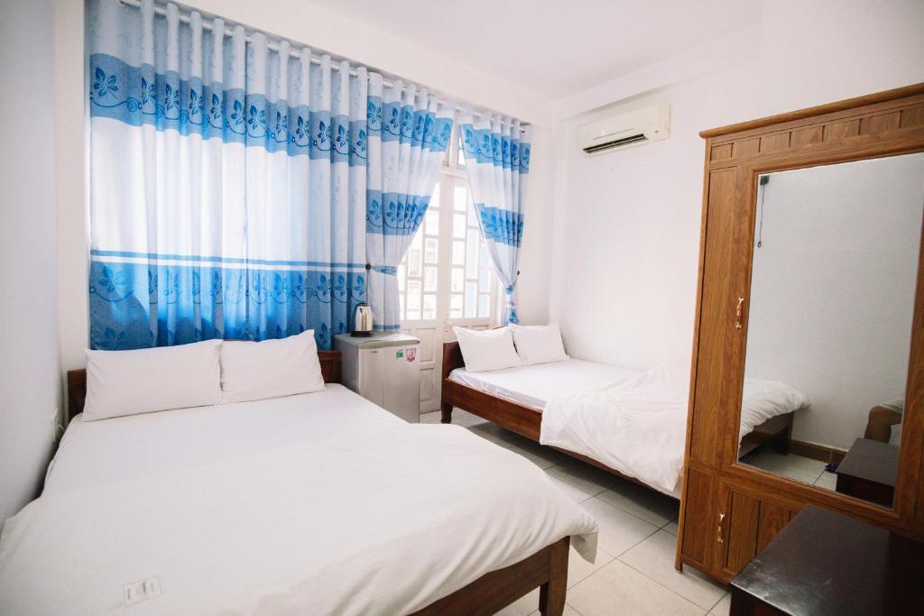 Giường trong phòng chung tại Lum Dong Tien Hotel