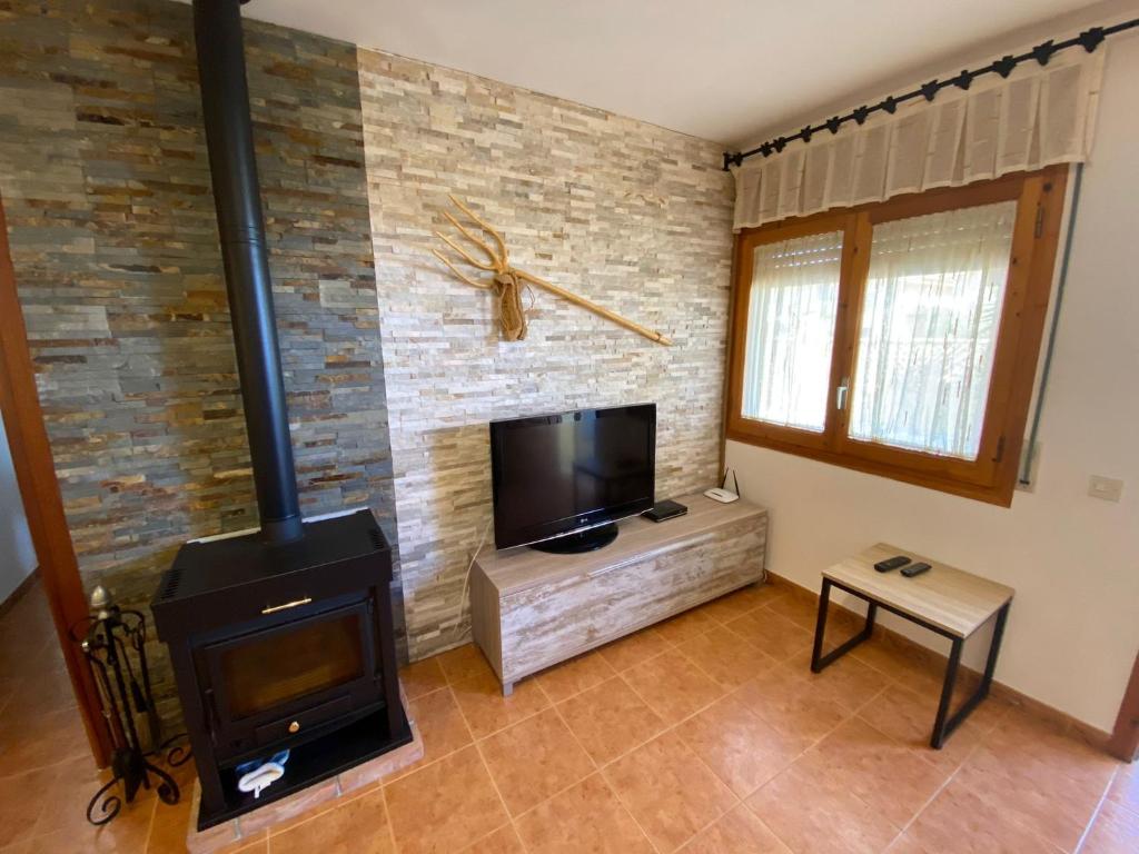 TV a/nebo společenská místnost v ubytování Casa La Gavina