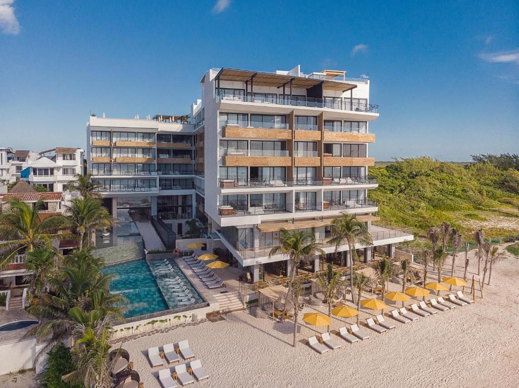 an aerial view of a hotel with a swimming pool at The Fives Oceanfront in Puerto Morelos