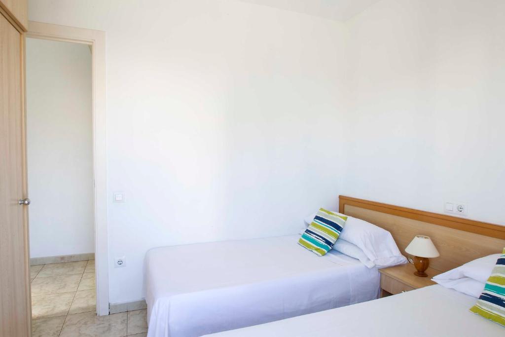 Posteľ alebo postele v izbe v ubytovaní Apartaments La Torreta