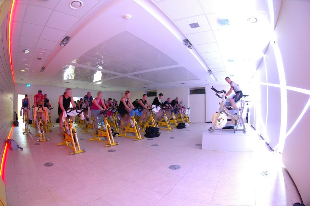 a group of people on bikes in a room at Mondorf Parc Hotel & Spa in Mondorf-les-Bains