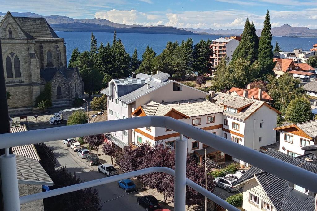 a view of a city with a church and a street at Reina Mora Apart Bariloche in San Carlos de Bariloche