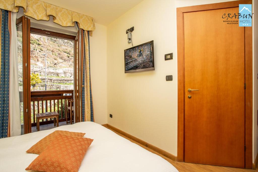 Postel nebo postele na pokoji v ubytování Crabun Hotel