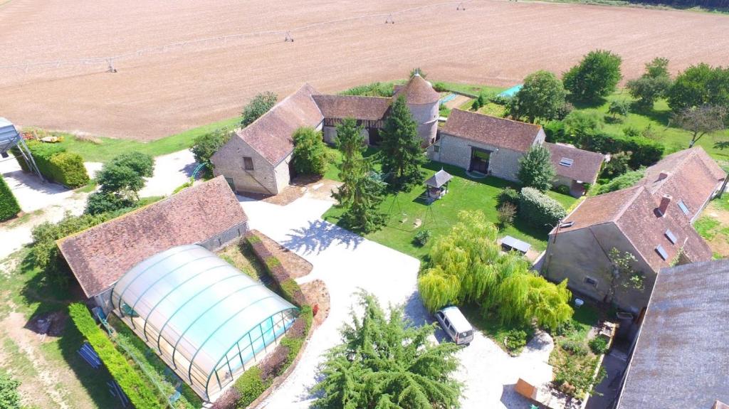an aerial view of a house with a silo at Gîtes du Martroy in Nargis