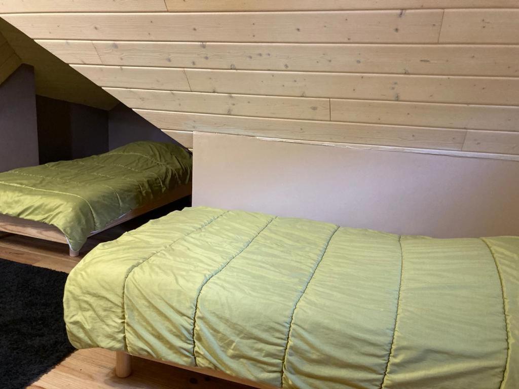 Een bed of bedden in een kamer bij Gite le Tilleul