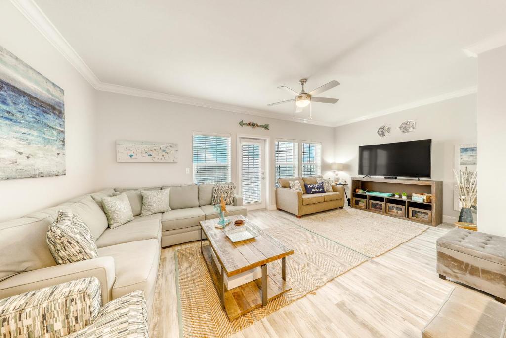 a living room with a couch and a tv at Pathway to the Sea 14816 in Padre Island