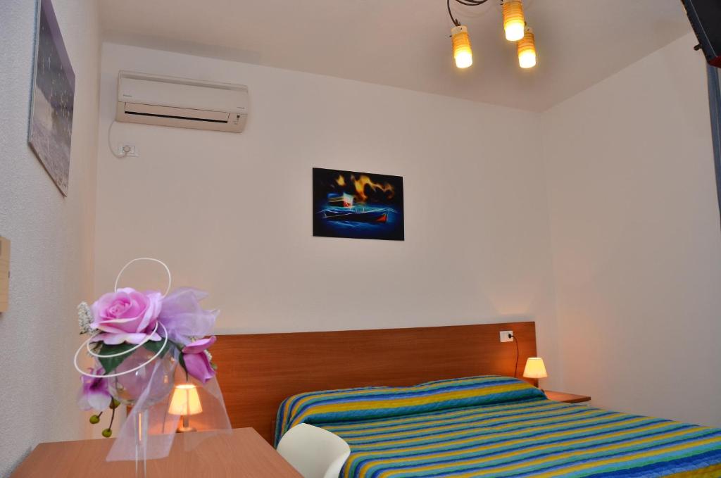 Postel nebo postele na pokoji v ubytování Domo - Guest-House Il Nespolo Fiorito