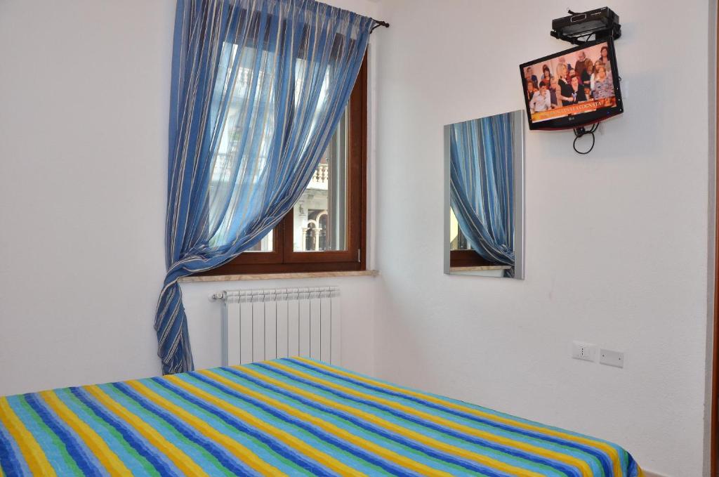 Postel nebo postele na pokoji v ubytování Domo - Guest-House Il Nespolo Fiorito