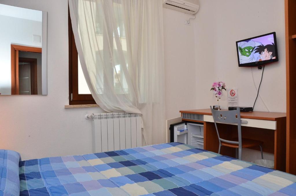 Postel nebo postele na pokoji v ubytování Domo - Guest-House Il Nespolo Fiorito
