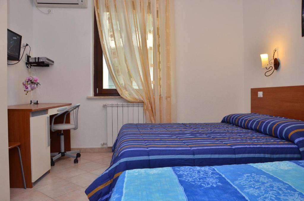 Postel nebo postele na pokoji v ubytování Domo - Guest-House Il Nespolo Fiorito
