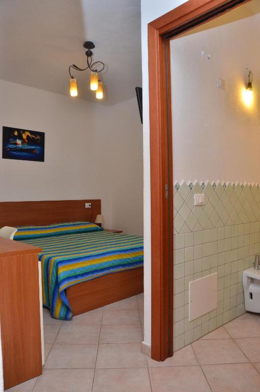 Postel nebo postele na pokoji v ubytování Domo - Guest-House Il Nespolo Fiorito