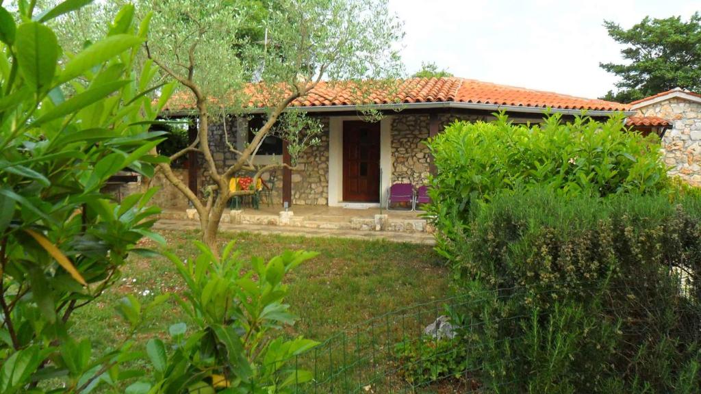 a small house with a garden in front of it at Holiday home in Rovinj/Istrien 11523 in Kokuletovica