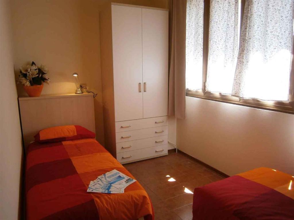 Кровать или кровати в номере Holiday home in Bibione 24579