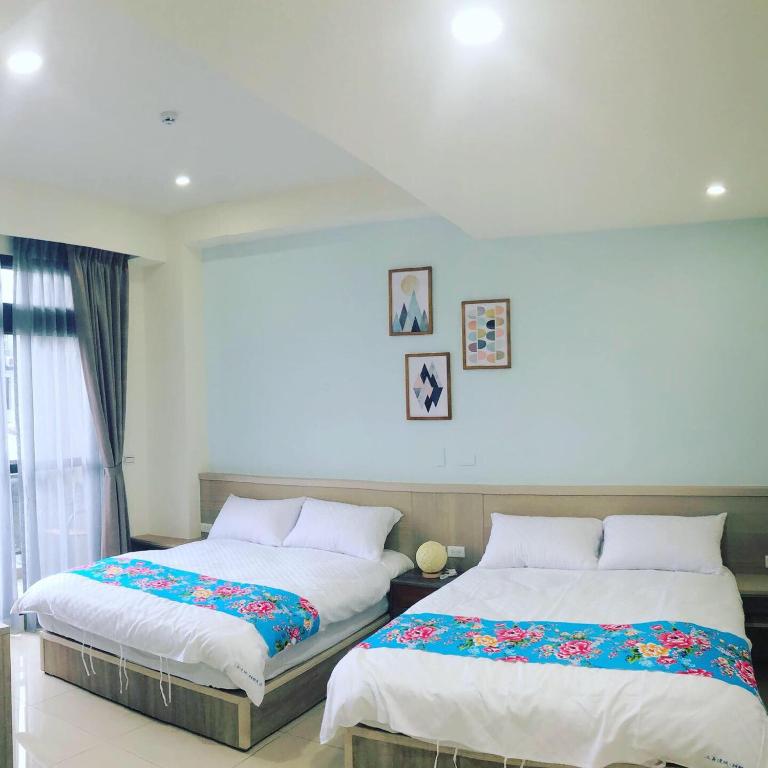Postel nebo postele na pokoji v ubytování Tung Shiang Homestay