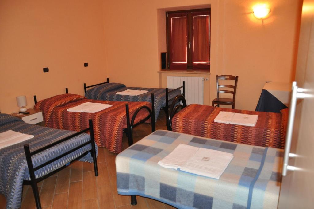 Postel nebo postele na pokoji v ubytování Locanda Dl'Angel