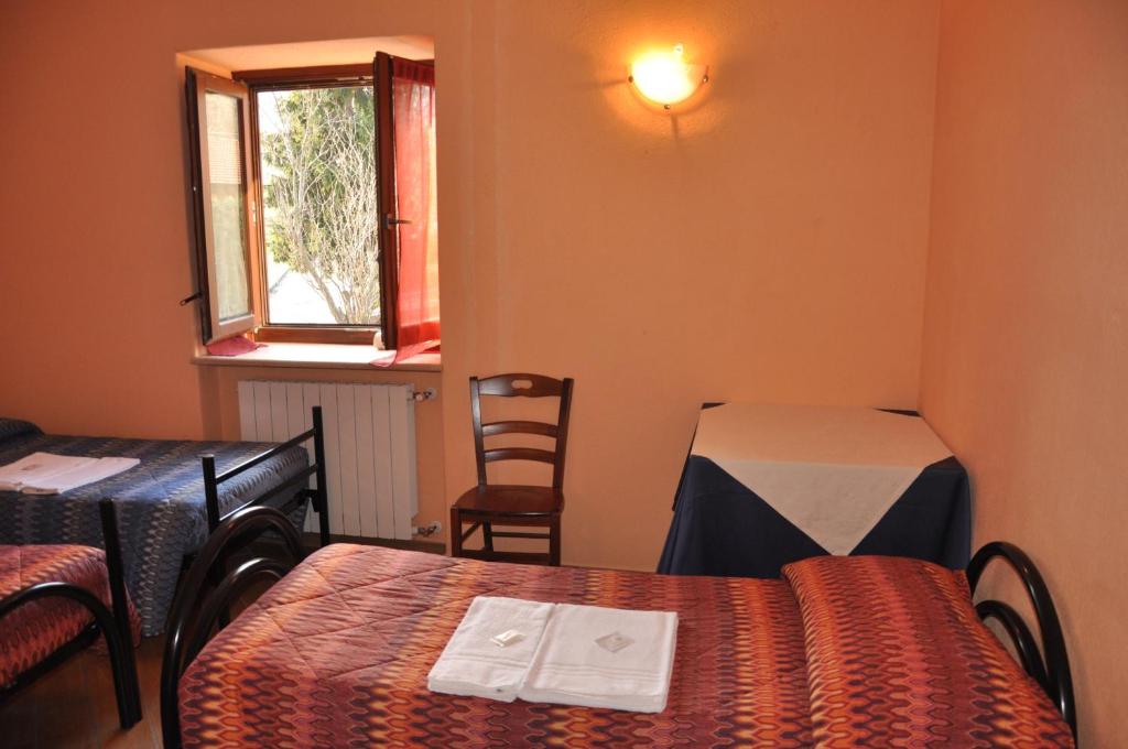 Postel nebo postele na pokoji v ubytování Locanda Dl'Angel