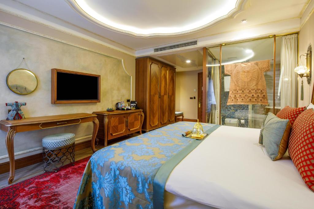 a hotel room with a bed and a television at Romance Istanbul Hotel Boutique Class in Istanbul
