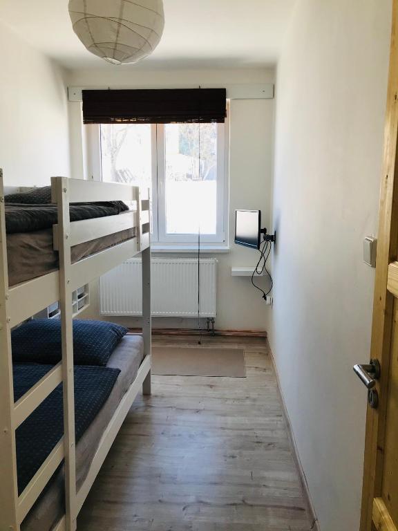 Postel nebo postele na pokoji v ubytování Apartmán Orlické Záhoří