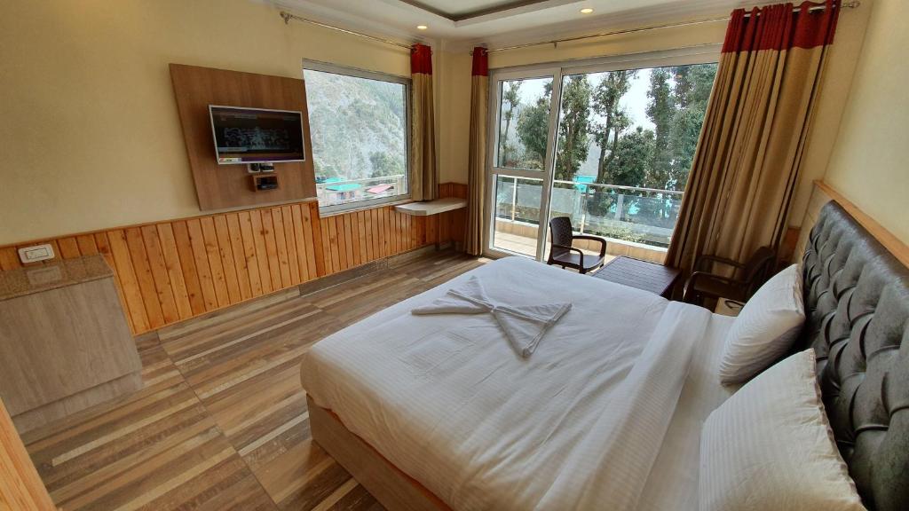 Postel nebo postele na pokoji v ubytování Nomadic Inn
