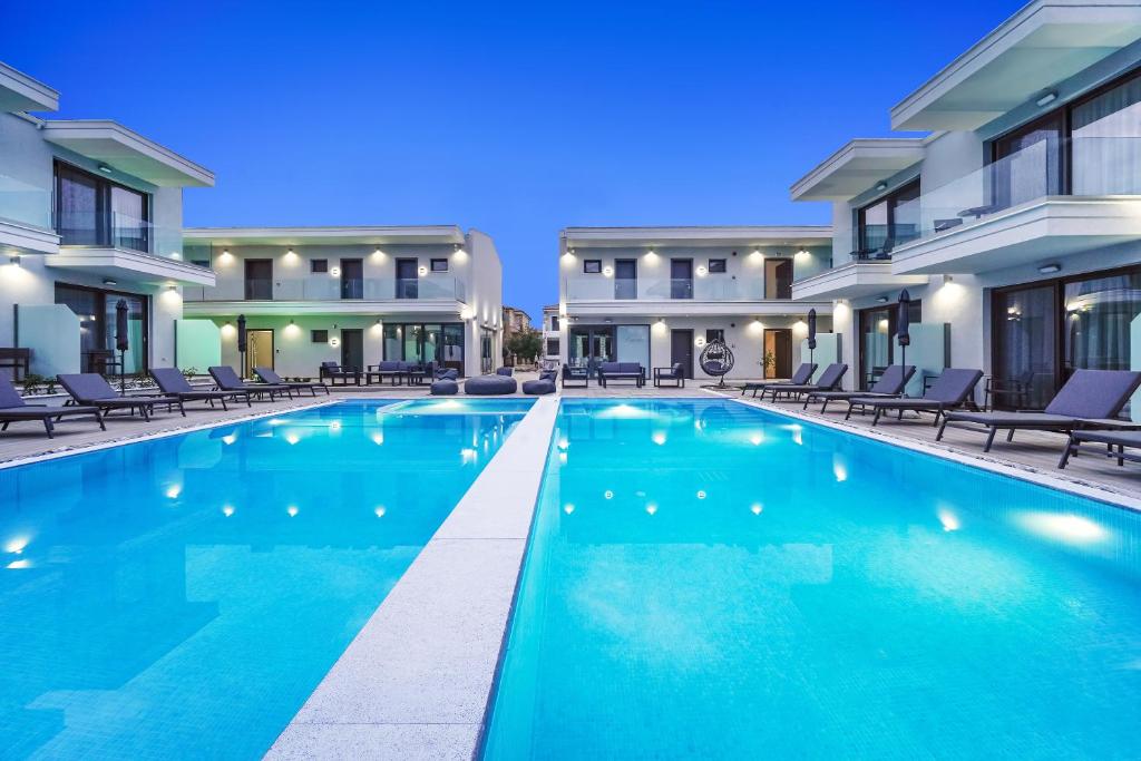 a swimming pool in the middle of a building at Anassa Blue Boutique Hotel in Limenas