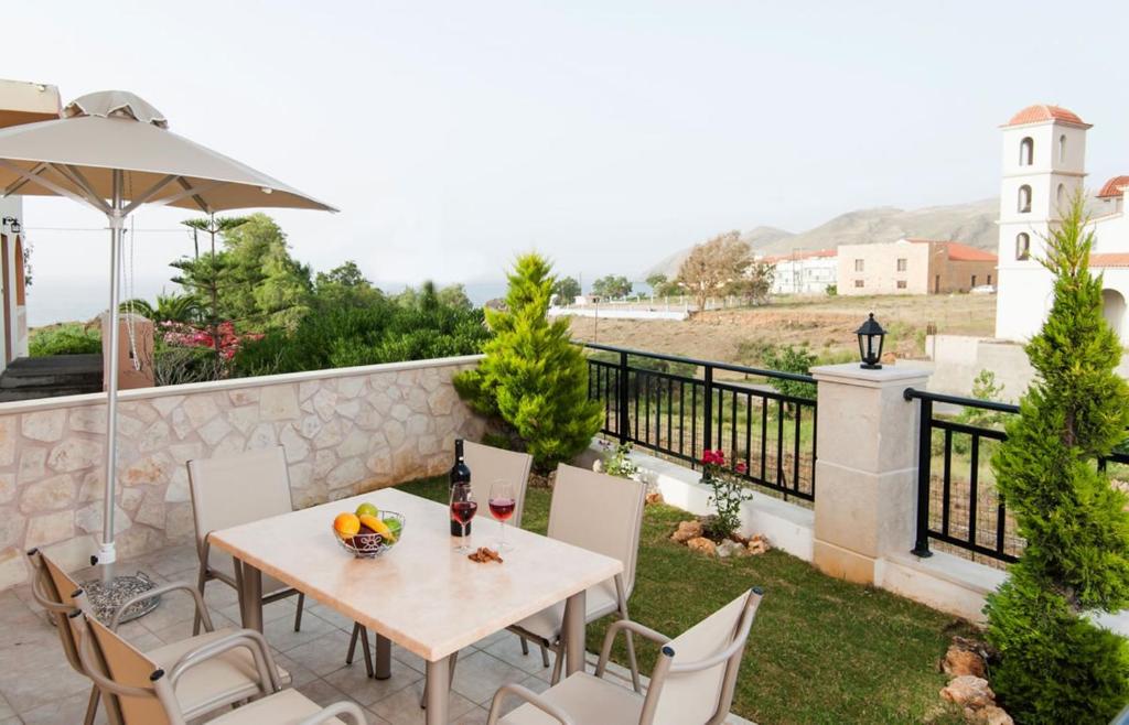 A balcony or terrace at Peonia and Ortansia Villas - Few Steps from the beach