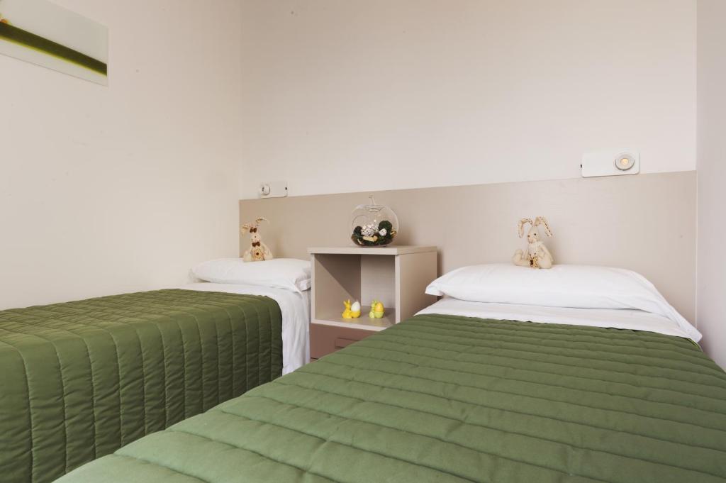 Postel nebo postele na pokoji v ubytování Piani di Clodia Holidaypark